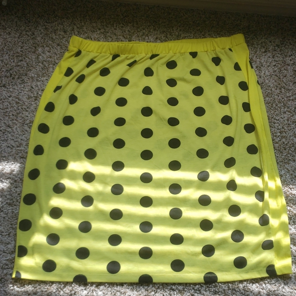 Neon yellow polka dot skirt.